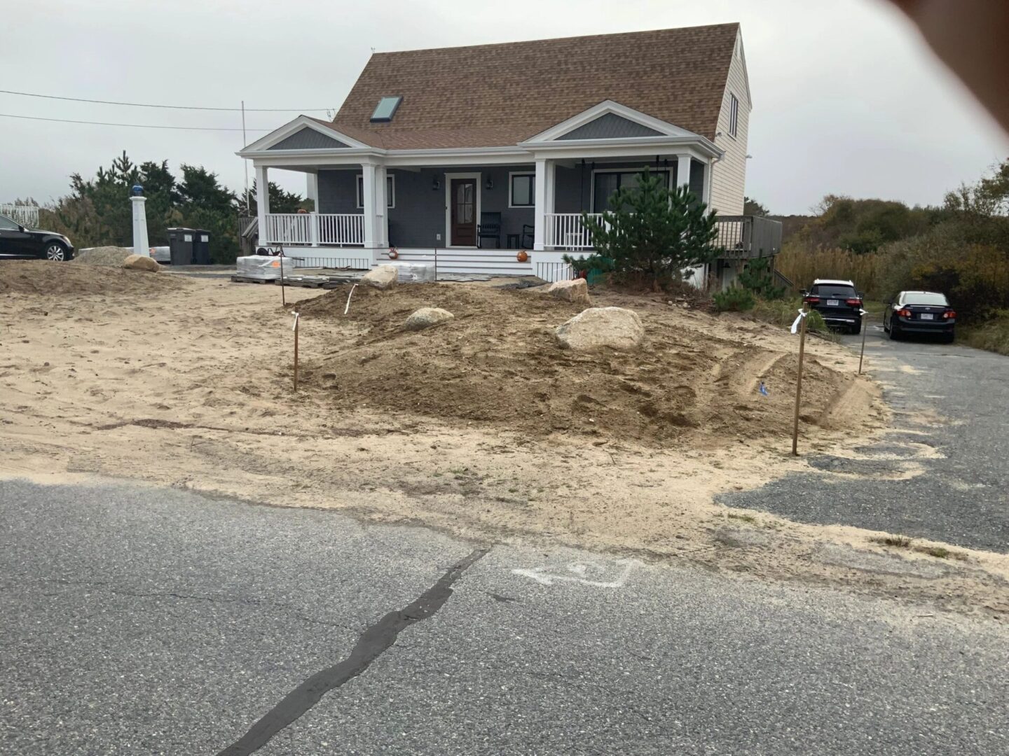 A house that is being remodeled in the sand.